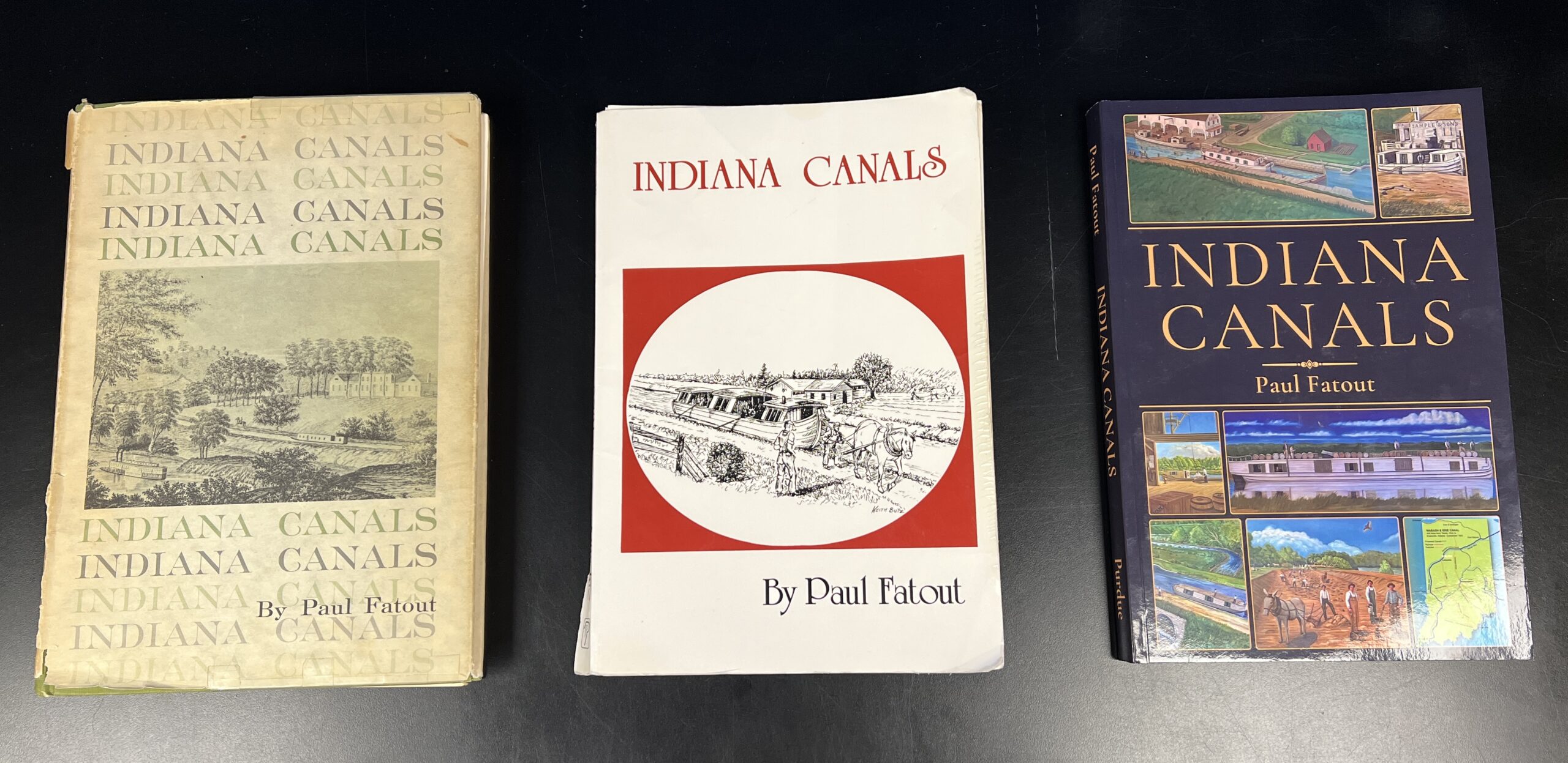 Three different editions of "Indiana Canals" by Paul Fatout are displayed next to each other